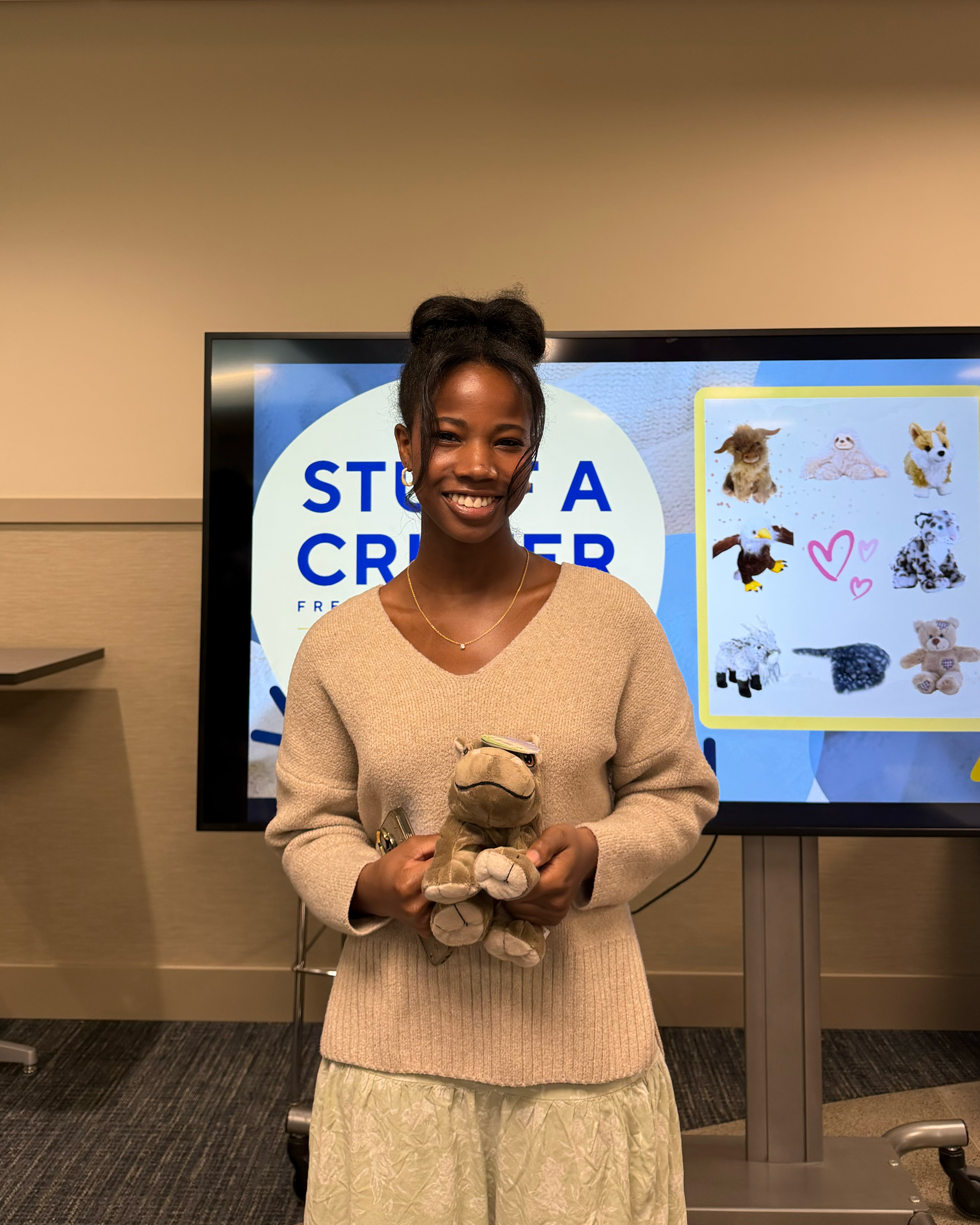 A girl holding critter